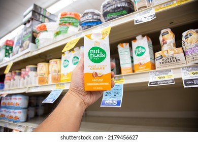 Los Angeles, California, United States - 05-20-2022: A View Of A Hand Holding A Carton Of Nut Pods Alternative Milk Creamer Product, On Display At A Local Grocery Store.