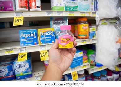 Los Angeles, California, United States - 05-20-2022: A View Of A Hand Holding A Bottle Of Pepto Bismol, On Display At A Local Grocery Store.