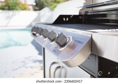 Los Angeles, California, United States - 05-20-2022: A Closeup View Of The Flame Adjuster Knobs Of An Outdoor Propane Grill Appliance.