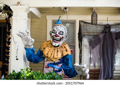 Los Angeles, California, US, October 2020: Ugly Clown And Creepy Death Near The Family Home. Scenery For Halloween In October. Decoration In The Yard