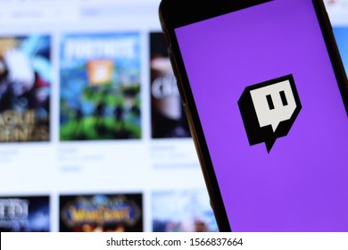 Los Angeles, California, USA - 21 November 2019: Twitch tv logo on phone screen with icon on laptop on blurry background, Illustrative Editorial