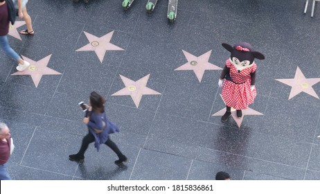 LOS ANGELES, CALIFORNIA, USA - 7 NOV 2019: Walk Of Fame Promenade On Hollywood Boulevard In LA. Pedastrians Walking Near Celebrity Stars On Asphalt. Walkway Floor Near Dolby And TCL Chinese Theatre.