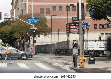 Los Angeles, California / USA - April 4, 2020: Street Vendor Selling Non Medical Face Masks On The Corner In Downtown Los Angeles During The Coronavirus Outbreak By Government Recommendation 