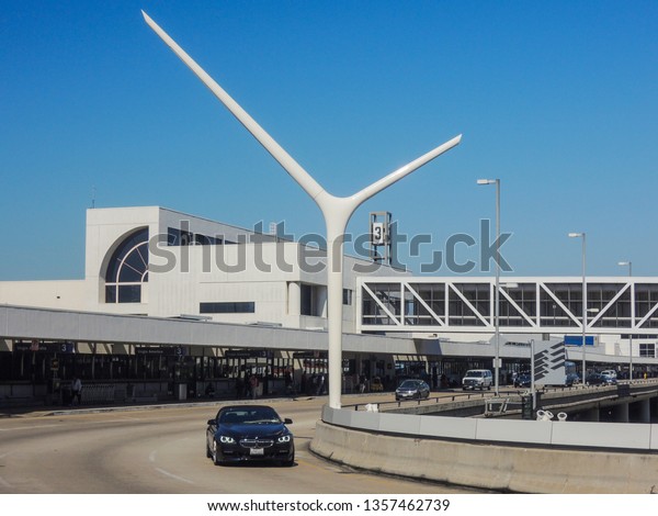 LOS ANGELES, CALIFORNIA /\
USA - April 24, 2014: A BMW passenger car is entering the Tom\
Bradley Intenational Departures area of Los Angeles International\
Airport. 