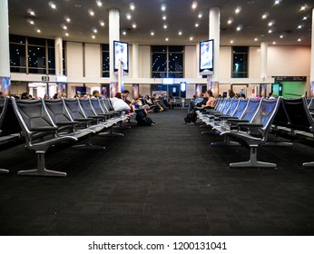 Los Angeles, California / USA - February 07 2017: Sparse Airport Terminal Empty Night Flight Red Eye Alone Waiting Holiday Plane Airplane Sitting