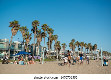 Los Angeles, California/ USA - July 1, 2019: A Group Of Friends Got Together To Play Beach Volleyball In A Warm Day