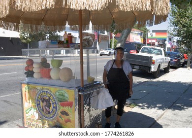 Los Angeles, California / USA - July 11, 2020:  Street Fruit Vendor With Protective Mask (PPE), On Melrose Avenue, During Pandemic.