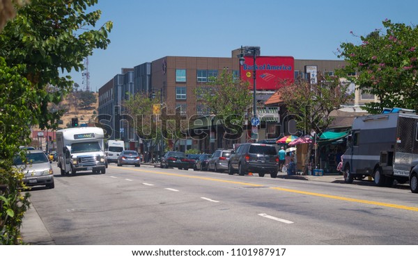 Los Angeles,\
California /USA - July 03 2017: China town in Los Angeles,\
California, USA. Colorful facades of traditional Chinese goods\
stores and street traffic at rush\
hour