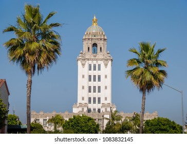 LOS ANGELES, CALIFORNIA, USA - MARCH 2009: The tower of the Beverly Hills City Hall framed by palm trees. The building featured as the police headquarters in the Beverly Hills Cop films