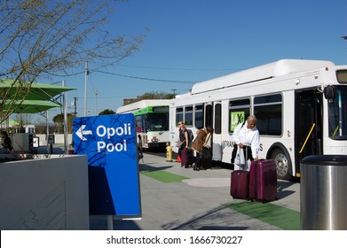 Los Angeles, California/ USA -March 3, 2020: LAX Passengers Get Off Free Airport Shuttle Bus Called LAXit At Staging Location For Taxi, Uber Lyft Opoli - No Curb Pick At Terminal Due To Construction 