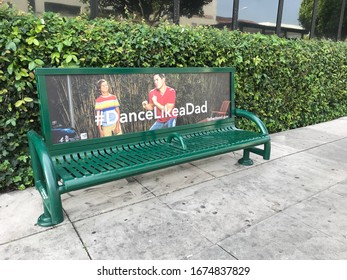 Los Angeles, California, USA - March 16, 2020 - A bus stop bench advertises 