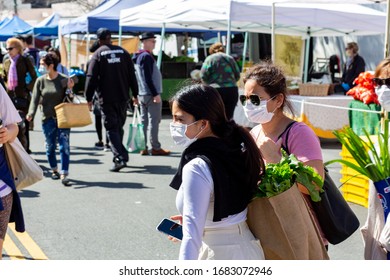 Los Angeles, California / USA - March 22, 2020: Women In Face Masks Shop At The Hollywood Farmers Market During Covid 19 Outbreak