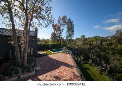 Los Angeles, California / USA - November 5, 2018: New Home Construction Completed In Los Angeles Showing Exterior And Interior Decoration With Pool, Beautiful Landscape Setting And Bocce Sport Court.