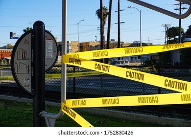 Los Angeles, California USA-June 7, 2020: Like Benches And Paths, An Outdoor Exercise Station In An LA County City Park Is Closed Off By Yellow Caution Tape During The Coronavirus Pandemic.