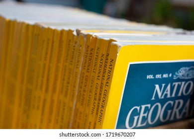 Los Angeles, California/United States - 04/30/2020: A Closeup View Of The Yellow Binding Cover Of Several Classic National Geographic Magazines On A Shelf.