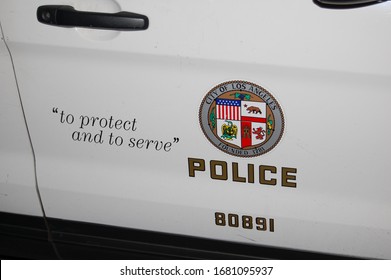 Los Angeles, California/United States of America - March 4, 2020: The passenger door of a Los Angeles Police Department squad car with the police seal and the words To Protect and to Serve
