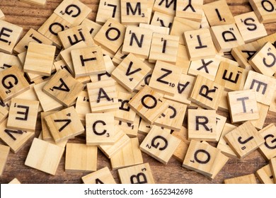 Los Angeles, CA/USA 02/20/2020 Wooden Scrabble letter tiles over a wooden table from above - Shutterstock ID 1652342698