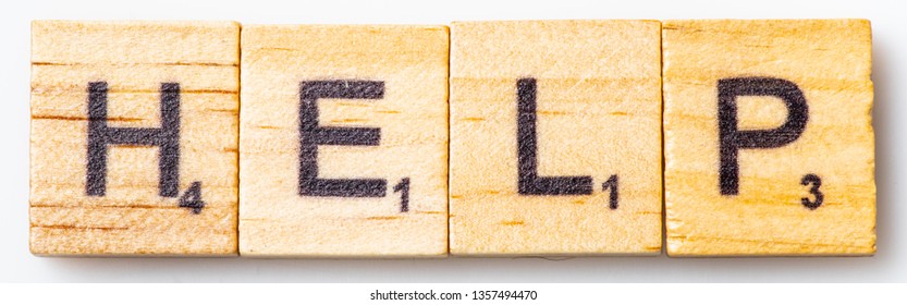 Los Angeles, CA/USA 02/26/2019 Word HELP In Scrabble Tiles From Above On White Background