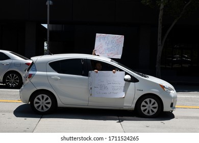 Los Angeles, CA/USA - April 22, 2020: Car Holding Sign Reading “Democrats Here” During Operation Gridlock Quarantine Protest In Los Angeles