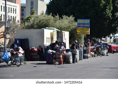 LOS ANGELES, CA/USA - JUNE 19, 2019: Homeless people at a recycling center cashing in cans and plastic bottles