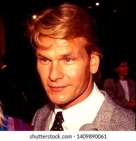 LOS ANGELES - Circa 1991:  Actor Patrick Swayze And His Wife Lisa Leave A Movie Theater.