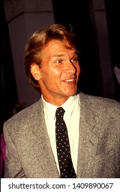 LOS ANGELES - Circa 1991:  Actor Patrick Swayze And His Wife Lisa Leave A Movie Theater.