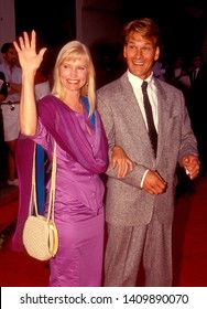 LOS ANGELES - Circa 1991:  Actor Patrick Swayze And His Wife Lisa Leave A Movie Theater.