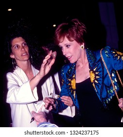 LOS ANGELES - Circa 1991: Carol Burnett Hurries Through A Crowd Of Fans Leaving Spago Restaurant.