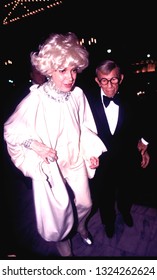 LOS ANGELES - Circa 1991: Carol Channing And George Burns Walk Into The Century Plaza Hotel.