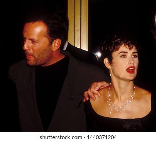 LOS ANGELES - Circa 1991: Demi Moore And Her Husband Bruce Willis Leave Roxbury Nightclub.