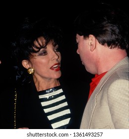 LOS ANGELES - Circa 1991: Joan Collins And Andrew Lloyd Webber Leave Spago Restaurant.