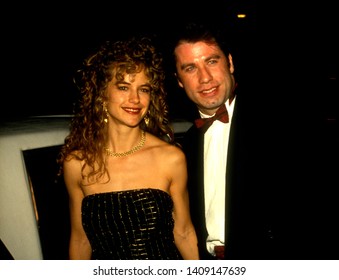 Los Angeles - Circa 1991:  John Travolta And His Wife Kelly Preston Depart Spago Restaurant.