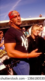 LOS ANGELES - Circa 1991: Wrestling Star Hulk Hogan And His Wife Linda Hogan Leave An Auto Repair Garage.