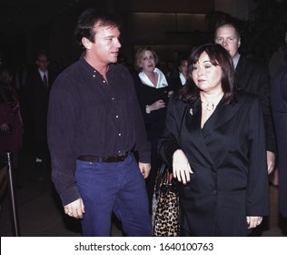 Los Angeles - Circa 1992: Actress Roseanne Barr And Her Husband Tom Arnold Leave The Monkey Bar Nightclub.