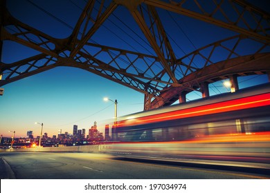 Los Angeles City At Night. Long Exposure Shot Of Blurred Bus Speeding Through Iconic 6th Street Bridge