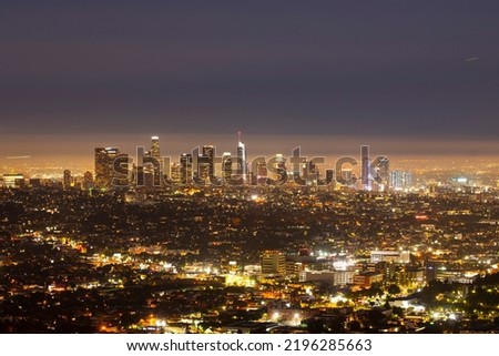 Los Angeles cityscape in California, USA. Beautiful sunset of Los Angeles downtown skyline and the city aerial. LA owntown buildings at night
