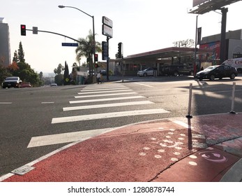 LOS ANGELES, Dec 12th, 2018: A Red Painted Curb Extension On Sunset Boulevard In West Hollywood, Part Of The Sunset Experience, A Pilot Project To Improve Pedestrian Safety And Walkability In The City