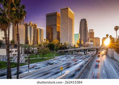 Los Angeles Downtown Buildings And Highway Car Traffic At Sunset