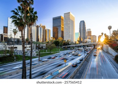 Los Angeles evening sunset highway traffic skyline buildings