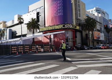 LOS ANGELES, Feb 21st, 2019: A Lone Police Officer Stands At The Hollywood And Highland Intersection, In Front Of Closed Off Hollywood Boulevard, Where Crews Are Preparing For The 91st Academy Awards.