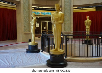 LOS ANGELES, FEB 24TH, 2017: Large golden Oscar statues guard the entrance to the Dolby Theatre where the Academy Awards are held.