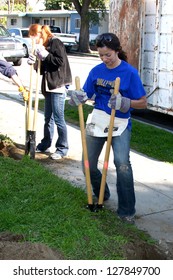 LOS ANGELES - FEB 9:  Theresa Castillo Digging New Fence Post Hole At The 4th General Hospital Habitat For Humanity Fan Build Day At The 191 E. Marker Street On February 9, 2013 In Long Beach, CA