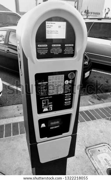 LOS ANGELES - February 23, 2019: Modern parking\
meters and payment kiosk