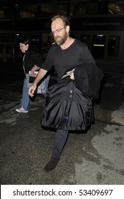 LOS ANGELES - FEBRUARY 5 : Australian Actor Hugo Weaving Star Of The Matrix And Lord Of The Rings Trilogies Is Seen With A Beard And Sunglasses At LAX. February 5, 2010 In Los Angeles, California