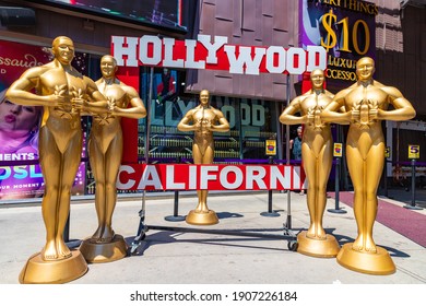 LOS ANGELES, HOLLYWOOD, USA - MARCH 29, 2020: Oscar statues at Walk of Fame in Hollywood, Los Angeles, California, USA
