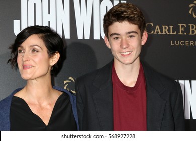 LOS ANGELES - JAN 30:  Carrie-Anne Moss, Owen Roy at the "John Wick: Chapter 2" Premiere at ArcLight Theater on January 30, 2017 in Los Angeles, CA