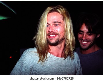 LOS ANGELES - January 25, 1994:  Longhaired Brad Pitt leaves Roxbury nightclub with friends.