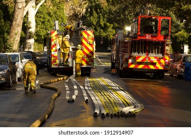 Los Angeles - January 8, 2021: 
Los Angeles Fire Crews Gather Hoses Following A House Fire On Courtney Ave. In Hollywood