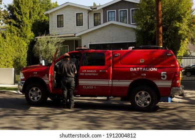 Los Angeles - January 9, 2021:
Fire Captain Inspects Fire Damage On Courtney Avenue Day Exterior