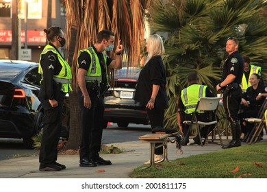 Los Angeles - July 2, 2021:
Los Angeles Police Officers Perform A Field Sobriety Test On Blonde Female Day Exterior
